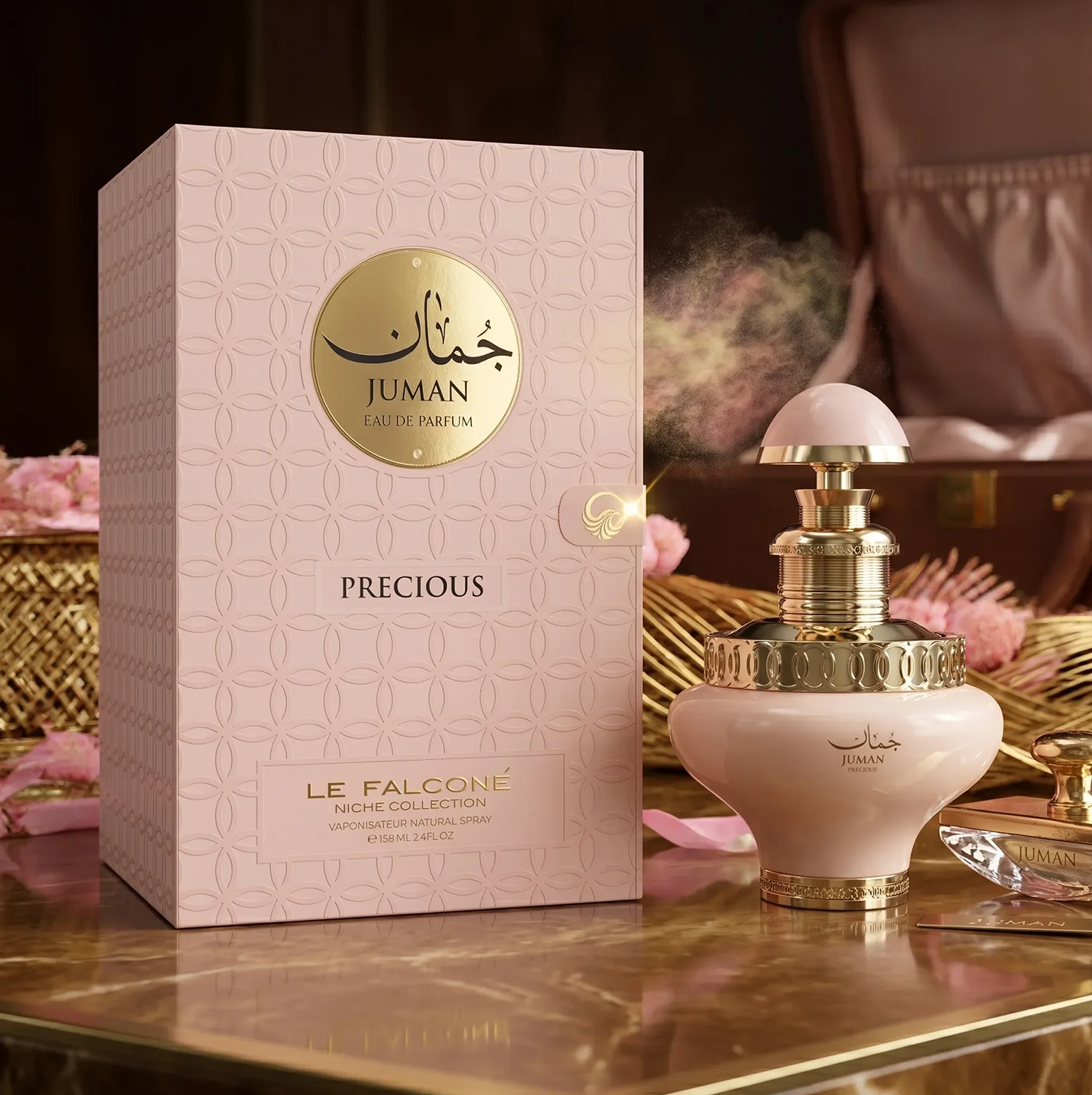 Una lujosa presentación del Eau de Parfum Juman Precious, con el frasco de 100 ml en tonos suaves junto a su caja de regalo decorada y estampada sobre una elegante superficie de mármol.